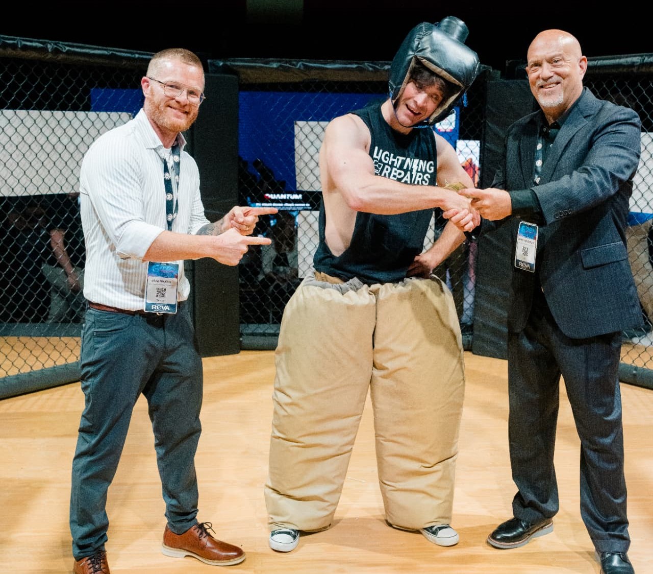 GRE 6.0 Smack Down winner in the padded sumo suit celebrating in The Octagon with the cash prize