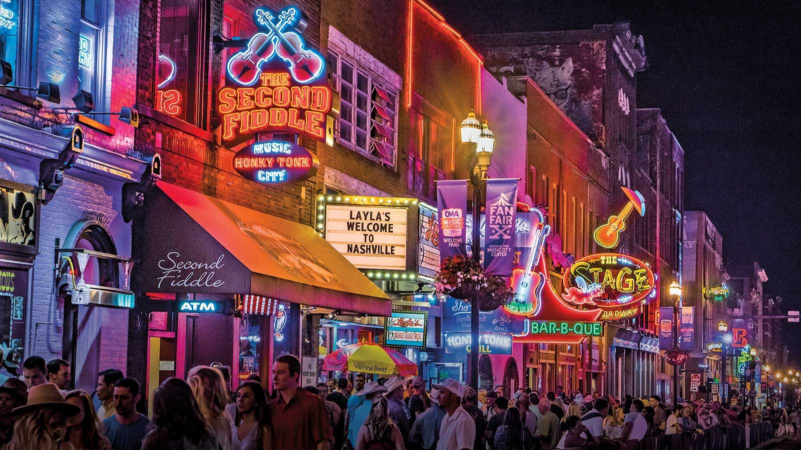 Downtown Nashville's Lower Broadway lit up with neon signs at night